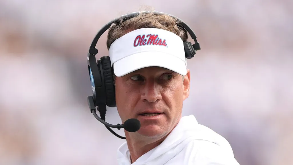 Lane Kiffin watching the action