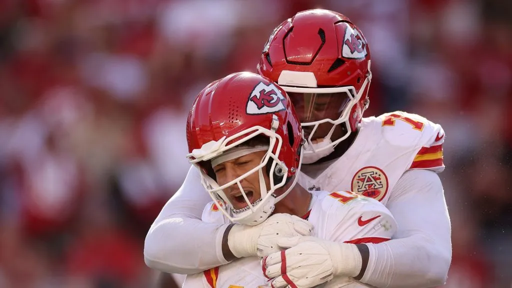 Jawaan Taylor hugs Patrick Mahomes.