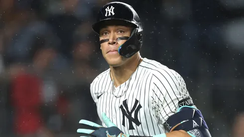 Aaron Judge #99 of the New York Yankees reacts to hitting a solo home run.