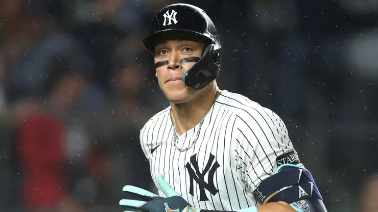 Aaron Judge #99 of the New York Yankees reacts to hitting a solo home run.