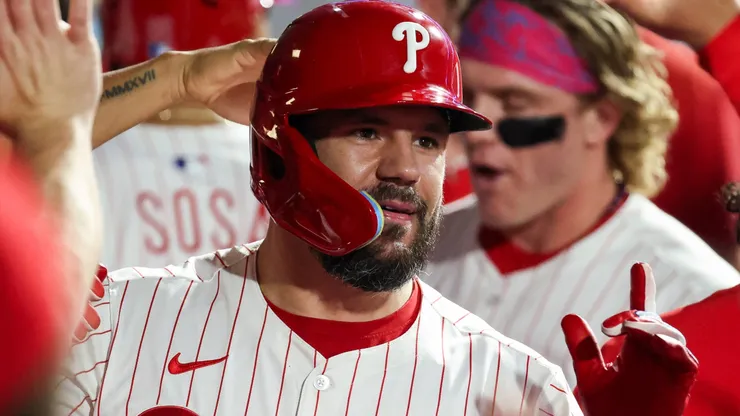Kyle Schwarber #12 of the Philadelphia Phillies reacts in the dugout after hitting a home run.