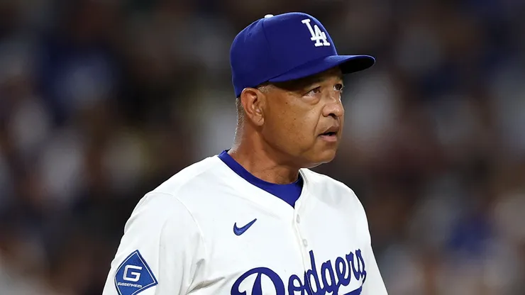 Dave Roberts #30 of the Los Angeles Dodgers looks on.
