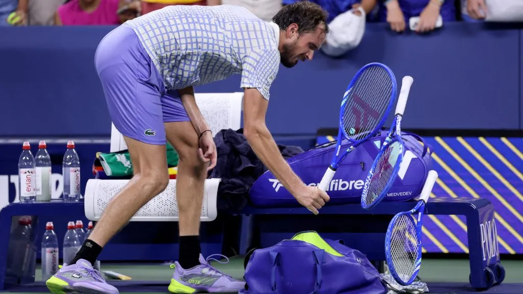 Daniil Medvedev breaks his racquet after losing in first round of the US Open. (Elsa/Getty Images)