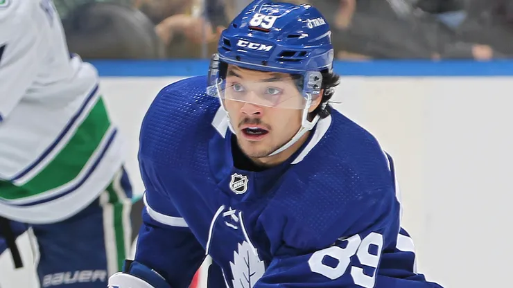 Nick Robertson #89 of the Toronto Maple Leafs skates with the puck.