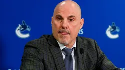 Head coach Rick Tocchet speaks to the media after an NHL game.