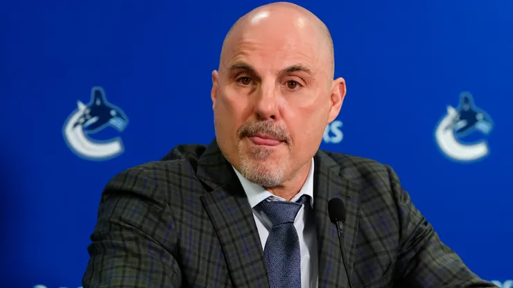 Head coach Rick Tocchet speaks to the media after an NHL game.