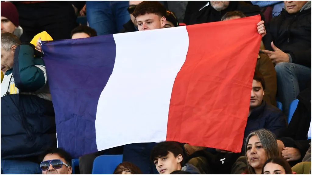A fan holds a flag of France – Rodrigo Valle/Getty Images
