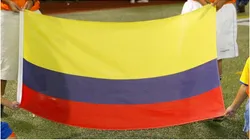 Children hold the flag of Colombia