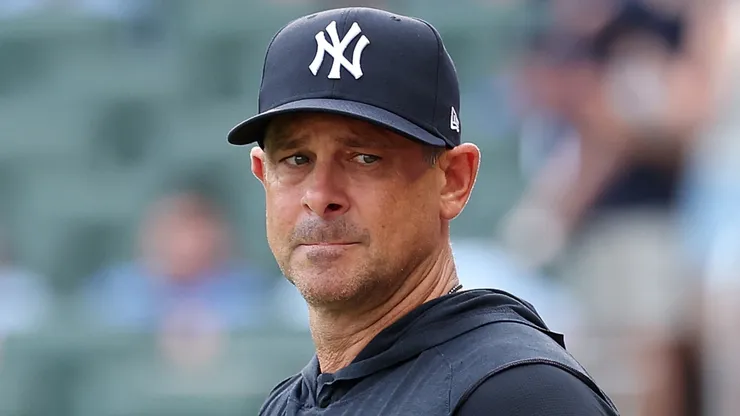 Manager Aaron Boone #17 of the New York Yankees steps out to the field.