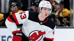 Luke Hughes #43 of the New Jersey Devils skates with the puck.