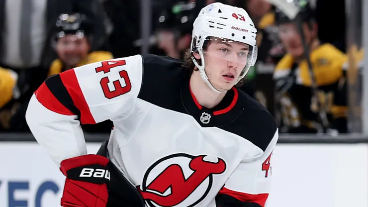 Luke Hughes #43 of the New Jersey Devils skates with the puck.