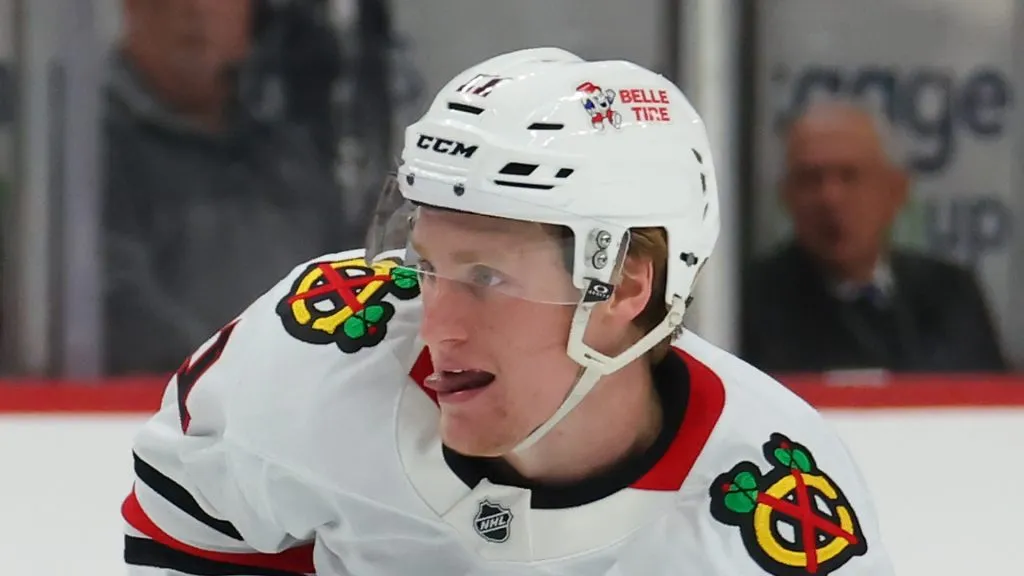 Oliver Moore #11 of the Chicago Blackhawks plays against the Detroit Red Wings