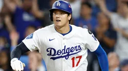 Shohei Ohtani #17 of the Los Angeles Dodgers celebrates after scoring a run against the Cincinnati Reds.