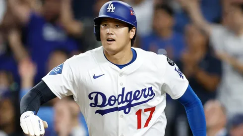 Shohei Ohtani #17 of the Los Angeles Dodgers celebrates after scoring a run against the Cincinnati Reds.