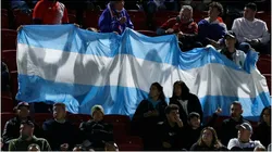 Fans hold up the Argentina flag