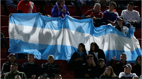 Fans hold up the Argentina flag