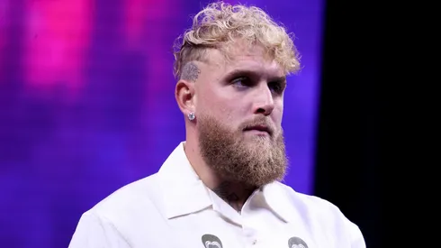 Jake Paul looks on at a news conference.