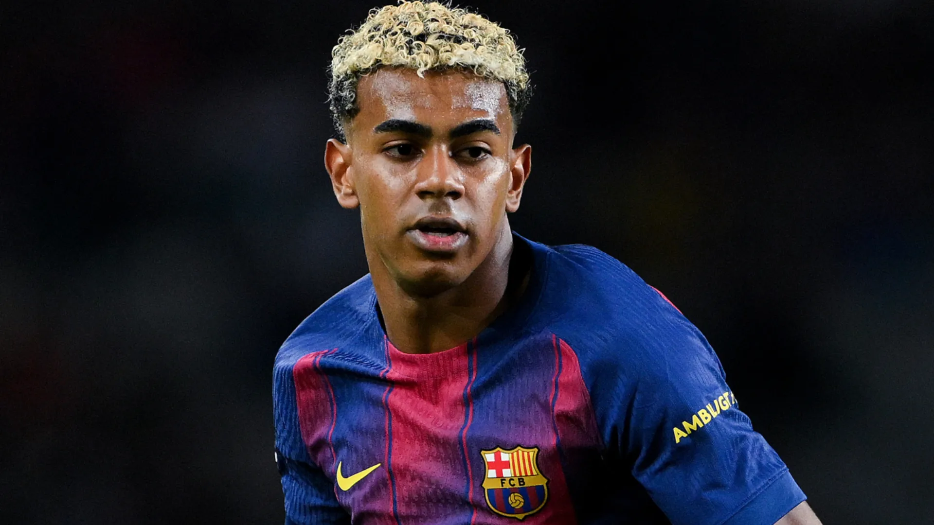 Barcelona star Lamine Yamal looking on