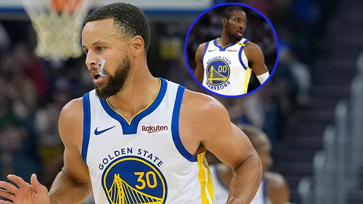 Stephen Curry #30 and Jonathan Kuminga #00 of the Golden State Warriors.