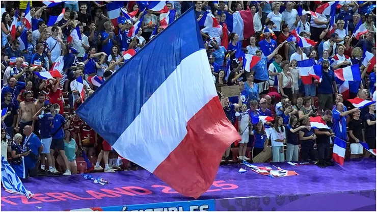 Fans of France celebrate victory by waving their national flag