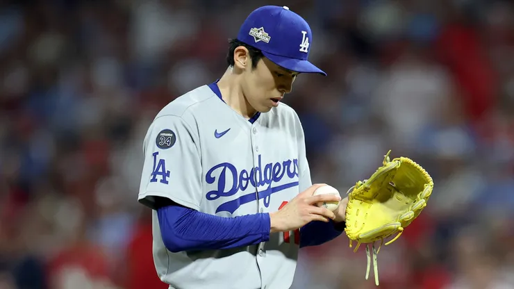 Roki Sasaki #11 of the Los Angeles Dodgers stands on the mound.