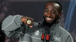 Terence Crawford poses with his undisputed super middleweight title ring and belt.