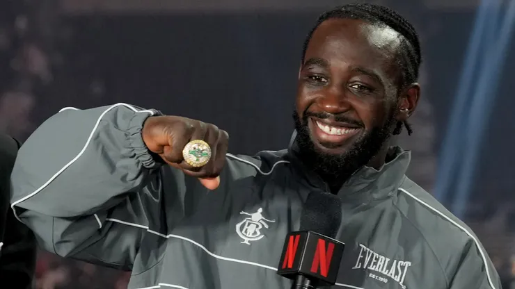 Terence Crawford poses with his undisputed super middleweight title ring and belt.