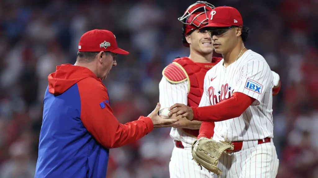 Rob Thomson #49 of the Phillies takes the ball from Jesus Luzardo #44 during a pitching change in the seventh inning against the Dodgers. (Photo by Emilee Chinn/Getty Images)