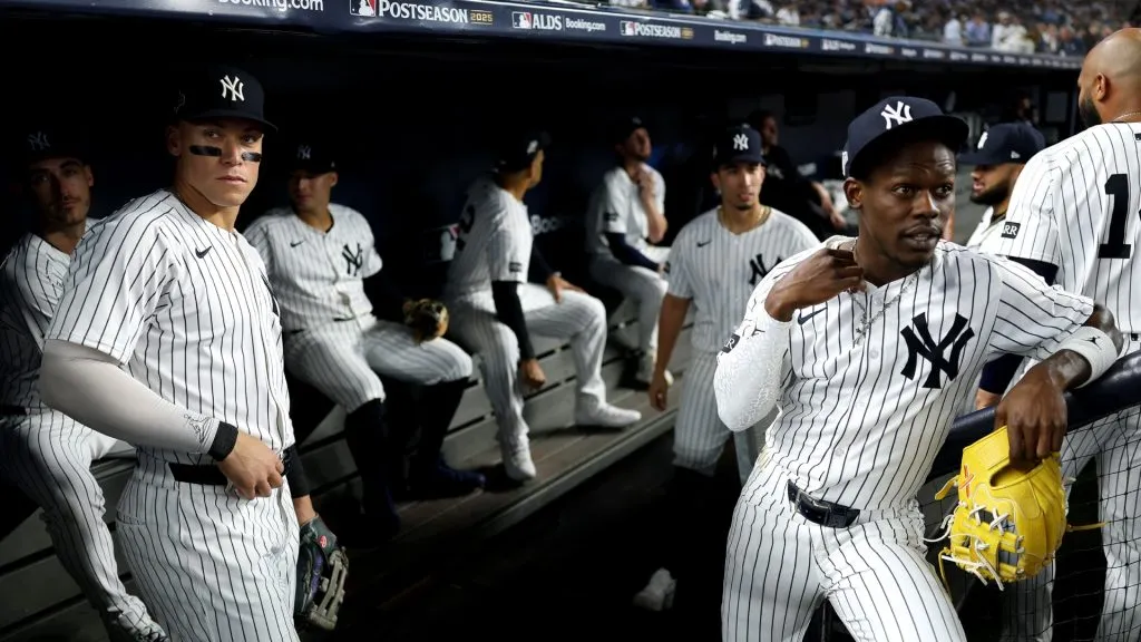 Aaron Judge #99 and Jazz Chisholm Jr. #13 of the Yankees look on in the dugout before the game against the Blue Jays in game three of the ALDS. (Photo by Al Bello/Getty Images)