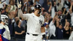 Aaron Judge #99 of the New York Yankees celebrates hitting a three-run home run.