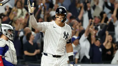 Aaron Judge #99 of the New York Yankees celebrates hitting a three-run home run.
