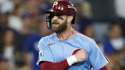Bryce Harper #3 of the Phillies reacts as he scores against the Dodgers.