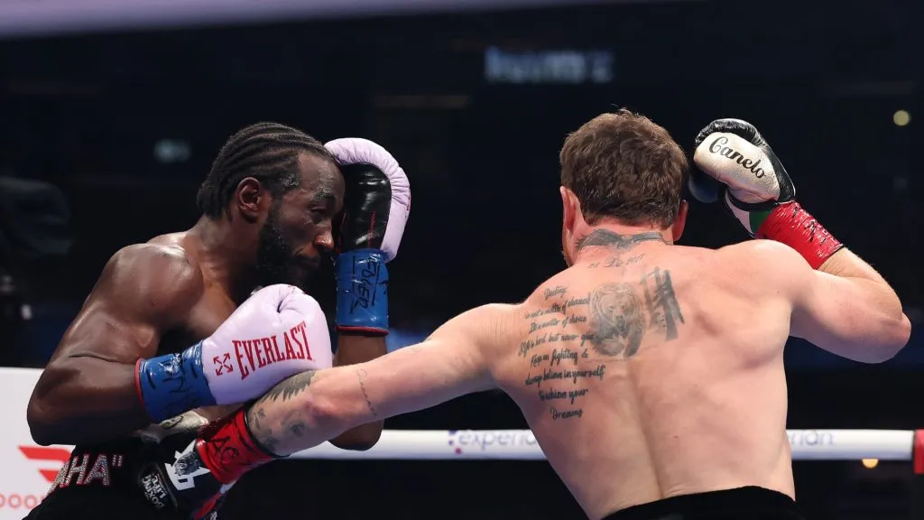 Canelo Alvarez throws a left punch at Terence Crawford in their undisputed super middleweight title fight. Sarah Stier/Getty Images for Netflix