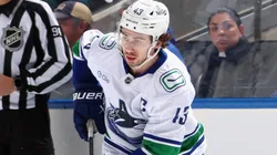 Quinn Hughes #43 of the Vancouver Canucks skates in an NHL game.