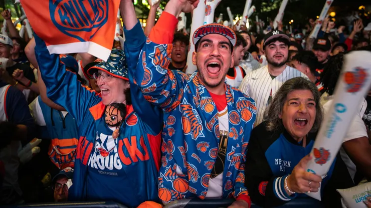 Stelios Yamalis (C) and other New York Knicks fans cheer during the first quarter in 2025.