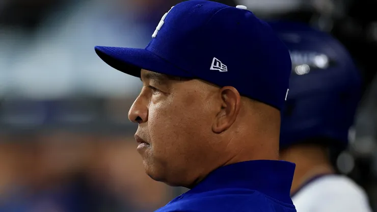 Manager Dave Roberts of the Los Angeles Dodgers looks on.