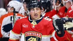 Brad Marchand #63 of the Panthers high fives teammates after scoring against the Flyers.