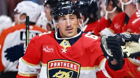 Brad Marchand #63 of the Panthers high fives teammates after scoring against the Flyers.