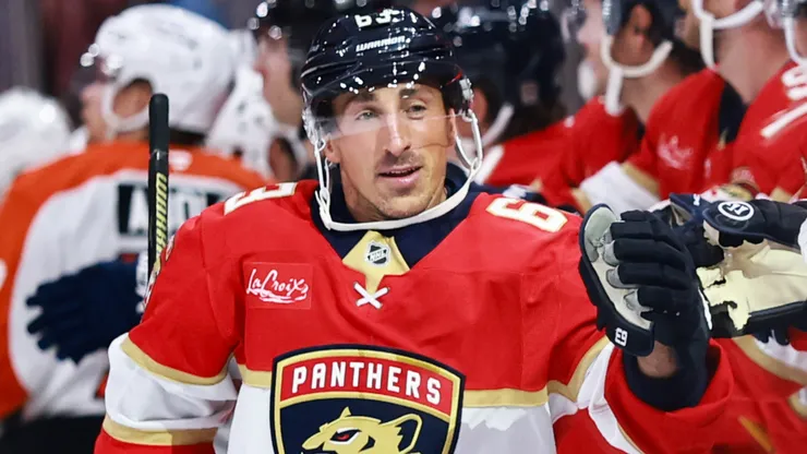 Brad Marchand #63 of the Panthers high fives teammates after scoring against the Flyers.