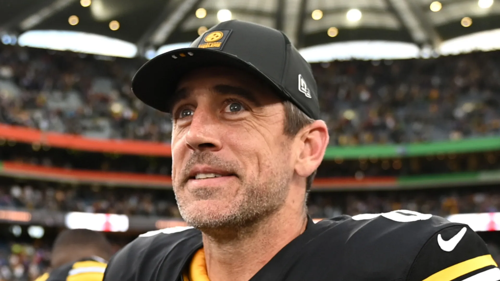 Aaron Rodgers looks on