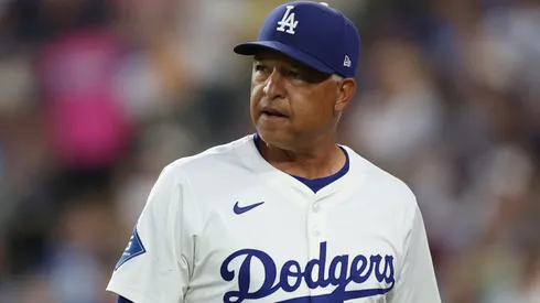 Dave Roberts looks on.