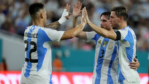Giovani Lo Celso celebrates with teammates his goal for Argentina against Venezuela.