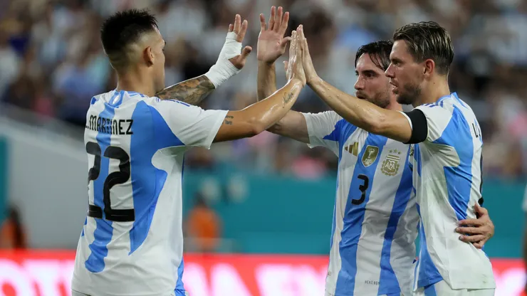 Giovani Lo Celso celebrates with teammates his goal for Argentina against Venezuela.