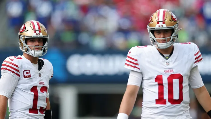 Brock Purdy and Mac Jones looks on during the third quarter vs the Seahawks on September 07, 2025 in Seattle, Washington.