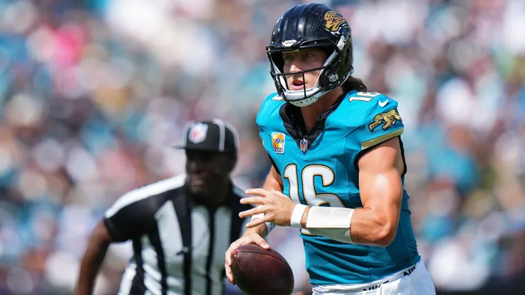 Trevor Lawrence #16 of the Jacksonville Jaguars runs the ball