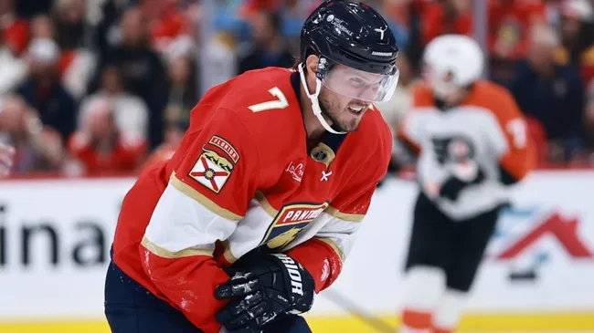 Dmitry Kulikov #7 of the Panthers skates off the ice gripping his arm against the Flyers. Carmen Mandato/Getty Images