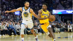 Bronny James of the Los Angeles Lakers drives against Stephen Curry of the Golden State Warriors