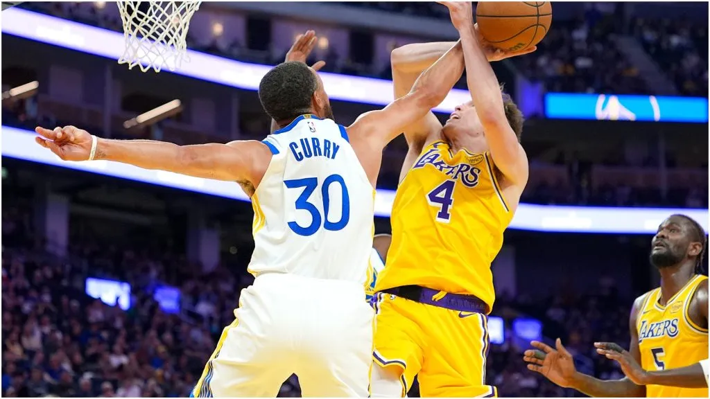 Dalton Knecht of the Los Angeles Lakers is fouled while shooting by Stephen Curry of the Golden State Warriors – Thearon W. Henderson/Getty Images