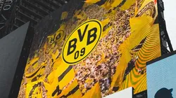 A screen in Times Square displays the Borussia Dortmund crest.