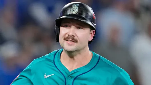 Cal Raleigh #29 of the Seattle Mariners tosses his bat after hitting a solo home run.